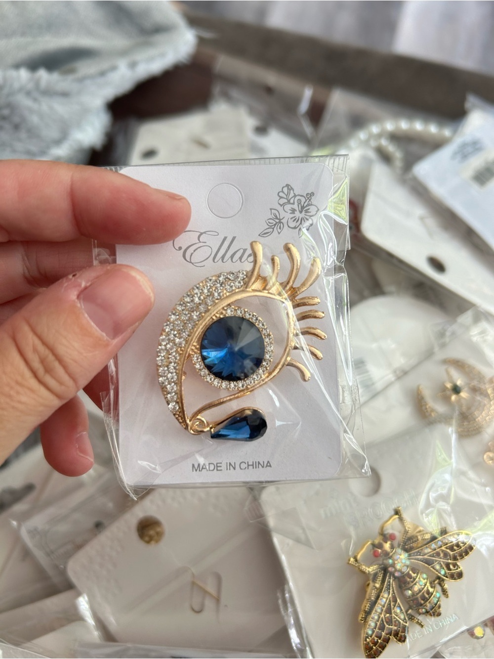 4/$50 Ella Gold-tone Brooch with Blue Crystal Eye and Teardrop